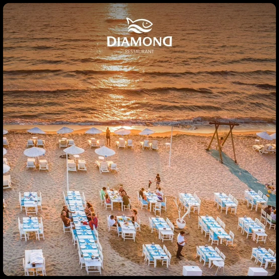 Diamond Beach Kuşadası — gün batımında sahil restoranı manzarası